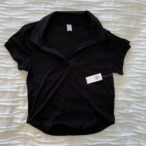 Black polo tee, not cropped, size medium